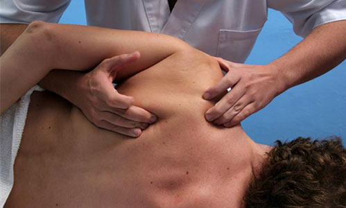 A patient having massage treatment for shoulder pain